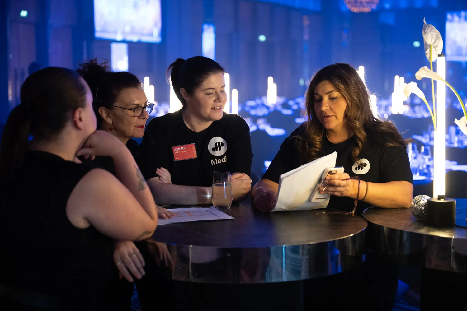 JP Media team members working together at an event
